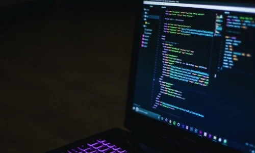 Laptop With Code on Screen